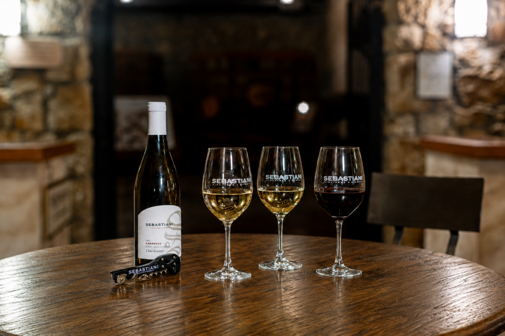 The Family Table tasting with a bottle of wine and three glasses of wine